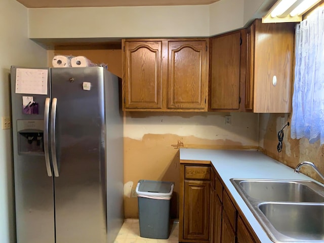 kitchen featuring sink and stainless steel fridge