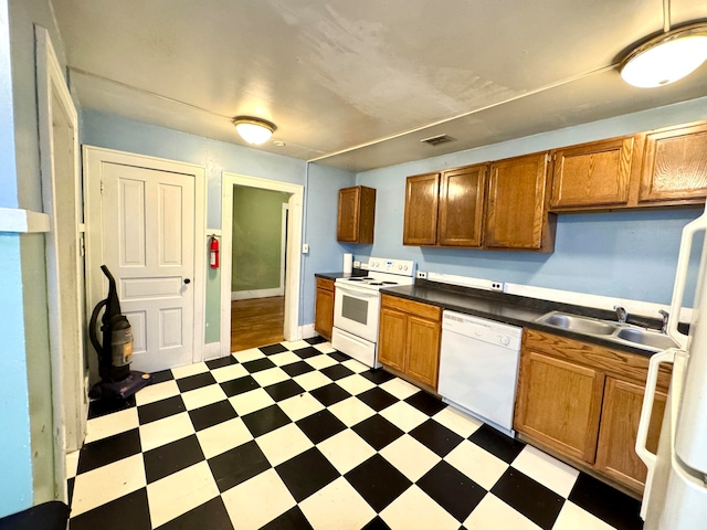 kitchen with sink and white appliances