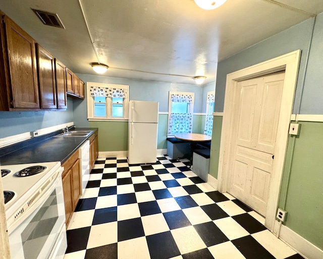 kitchen with white appliances and sink