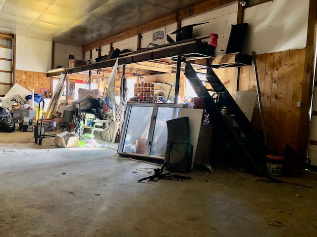 garage featuring wooden walls