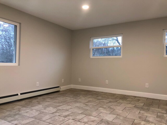 spare room with a baseboard heating unit