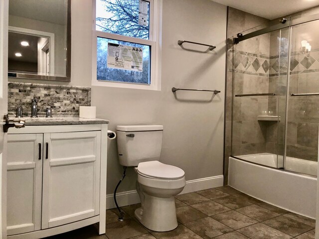 full bathroom with enclosed tub / shower combo, tasteful backsplash, toilet, vanity, and tile patterned floors