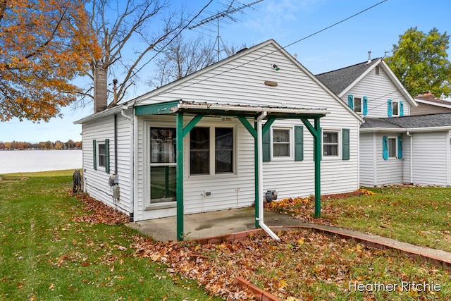 exterior space with a front yard and a patio