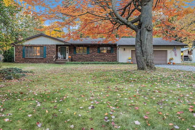 single story home with a front lawn and a garage