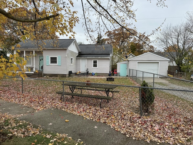 view of front facade featuring an outbuilding and a garage