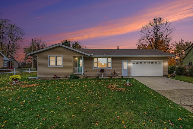 ranch-style house with a lawn and a garage