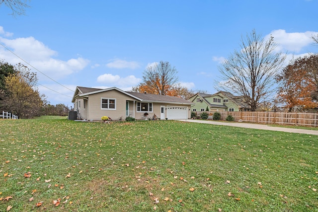 ranch-style home featuring central AC unit, a garage, and a front yard