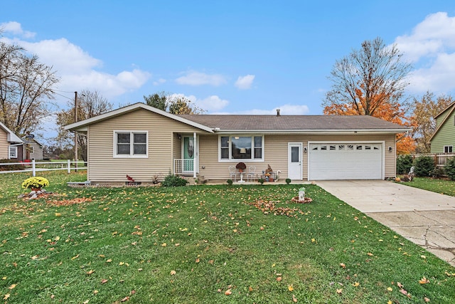 single story home featuring a garage and a front yard