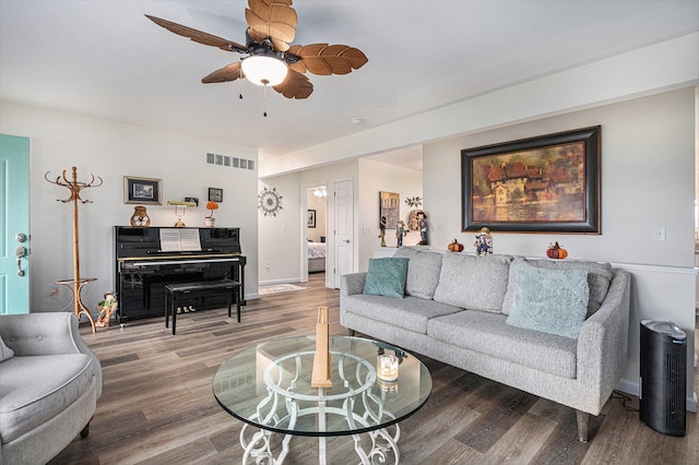 living room featuring hardwood / wood-style flooring and ceiling fan