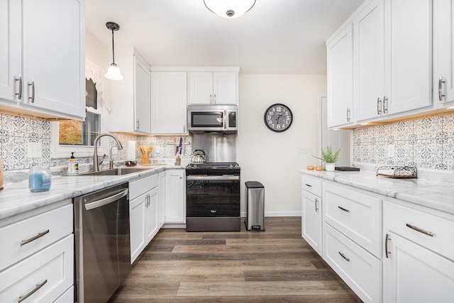 kitchen featuring appliances with stainless steel finishes and white cabinets