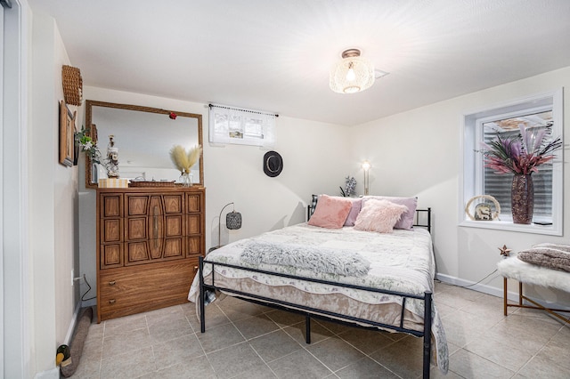 bedroom with light tile patterned flooring