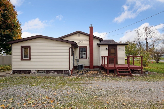 back of property with a wooden deck