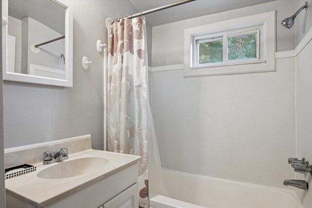 bathroom featuring vanity and shower / tub combo