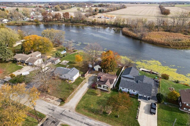 aerial view with a rural view and a water view