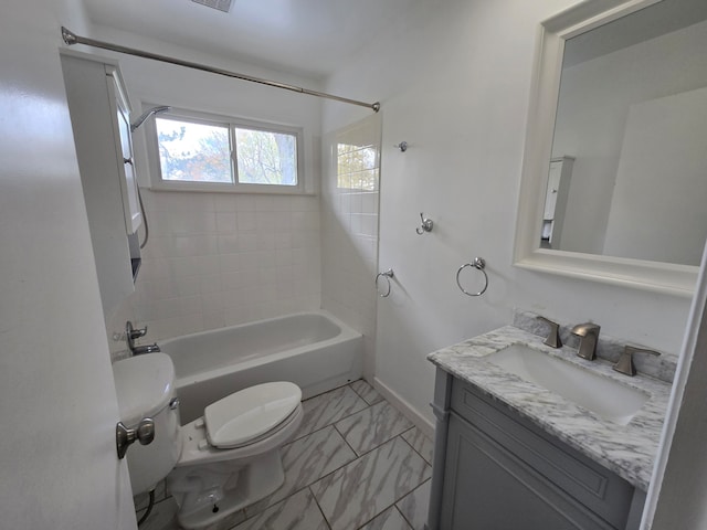 full bathroom with vanity, toilet, and tiled shower / bath