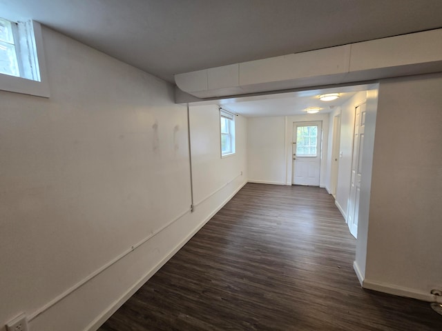 basement featuring dark wood-type flooring