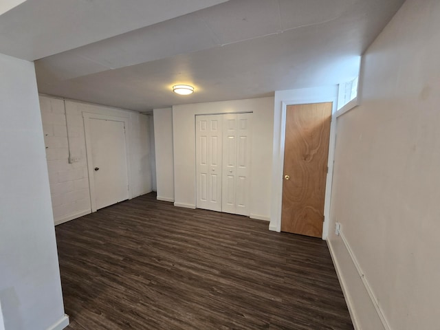 unfurnished bedroom featuring dark hardwood / wood-style flooring