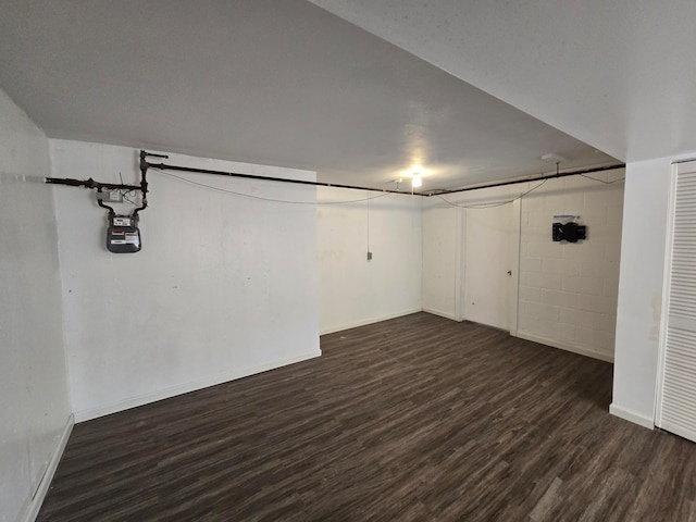 basement featuring dark hardwood / wood-style flooring