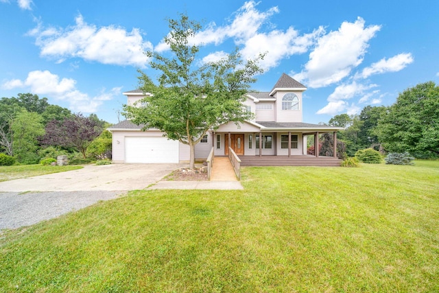 view of front of property with a front lawn, a garage, and covered porch