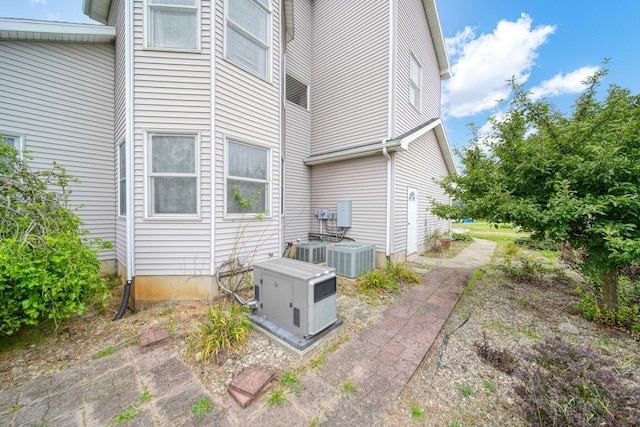 view of home's exterior featuring central air condition unit