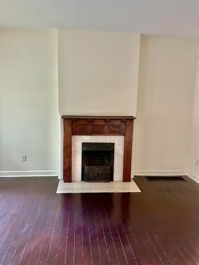 room details featuring wood-type flooring and a fireplace