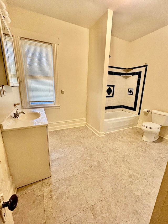 bathroom featuring toilet, vanity, a wealth of natural light, and tile patterned floors