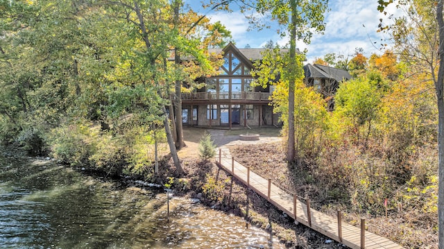 rear view of house with a water view