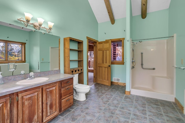 bathroom featuring beam ceiling, vanity, a shower, tile patterned floors, and toilet