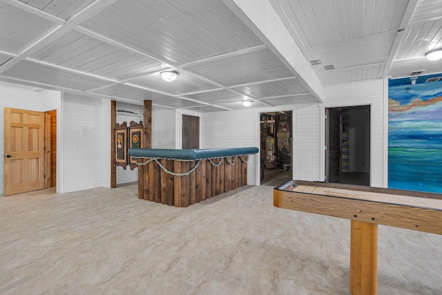 bar featuring water heater and brick wall