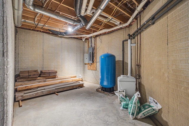 basement with electric panel and brick wall