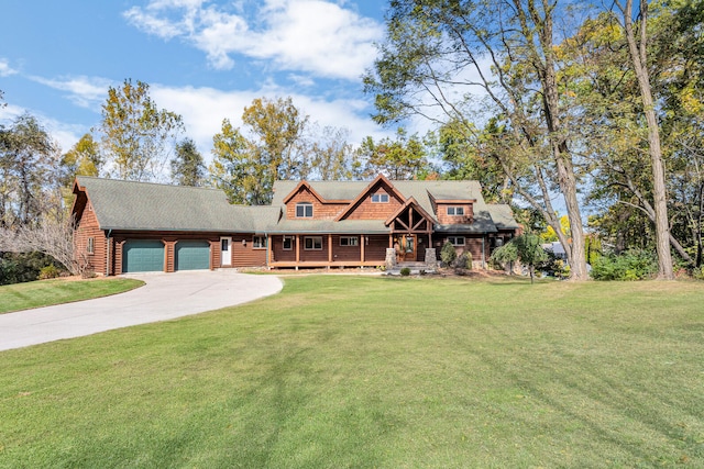 view of front of property with a front lawn and a garage