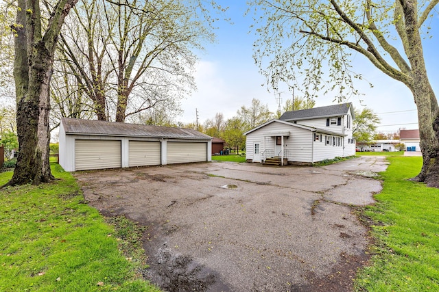 garage with a yard