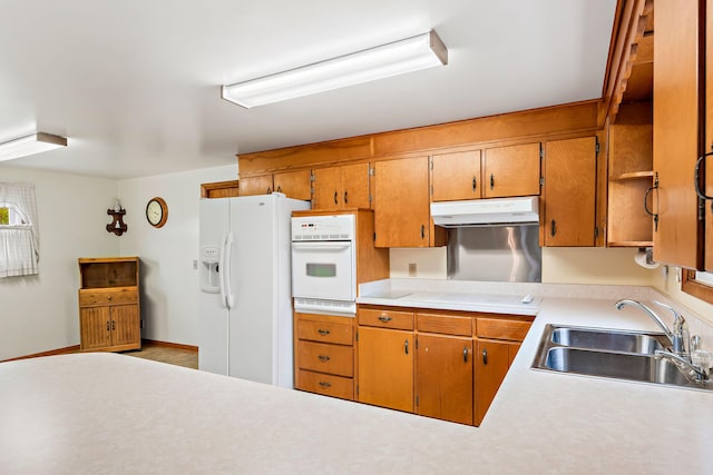 kitchen featuring white appliances and sink