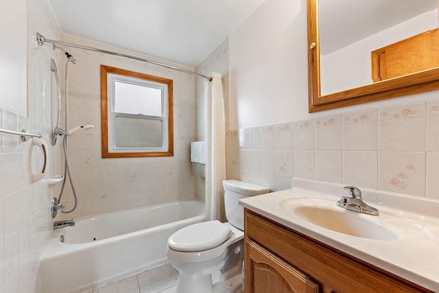 full bathroom with vanity, shower / bath combo with shower curtain, toilet, and tile walls