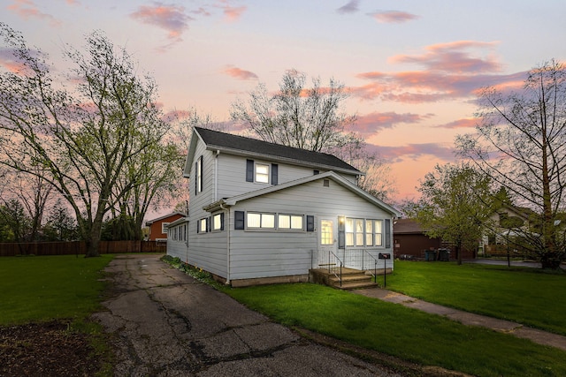 view of front of home with a lawn