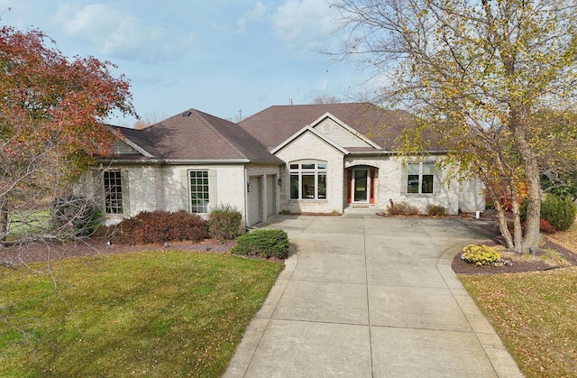 ranch-style home with a front lawn