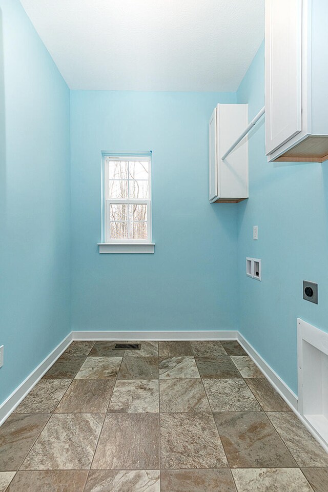 laundry room with hookup for a washing machine, cabinets, and hookup for an electric dryer