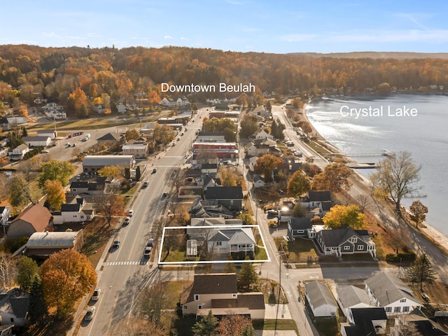 87 S Center St, Beulah, MI 49617 - aerial overview of property's location featuring a nearby body of water, a forest, and nearby suburban area