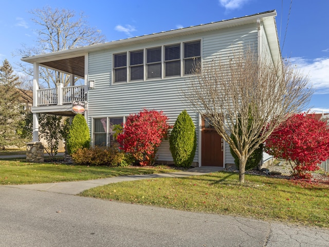87 S Center St, Beulah, MI 49617 - view of front of property featuring a front lawn