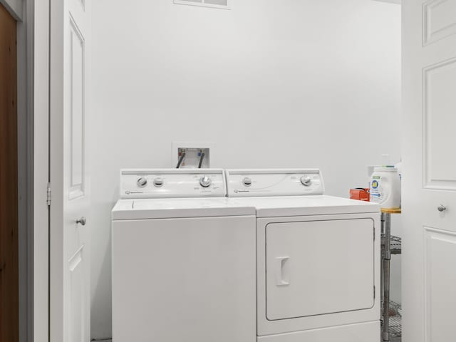 87 S Center St, Beulah, MI 49617 - washroom featuring washer and dryer