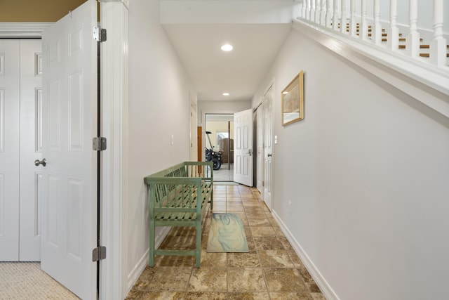 87 S Center St, Beulah, MI 49617 - hall featuring baseboards, recessed lighting, and stone finish flooring