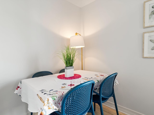 87 S Center St, Beulah, MI 49617 - dining space with baseboards and wood finished floors