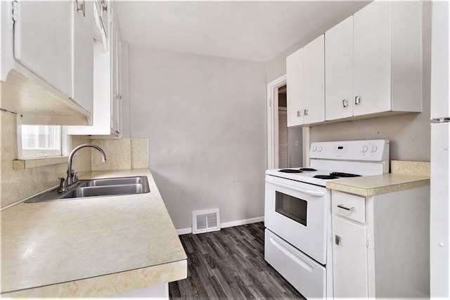 kitchen featuring white electric range oven, dark hardwood / wood-style flooring, white cabinetry, and sink