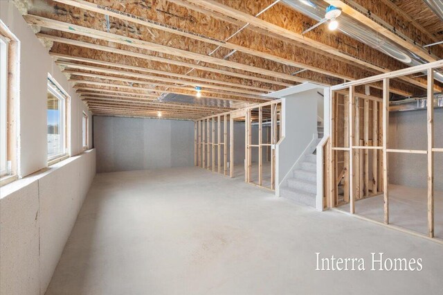 basement featuring stairs