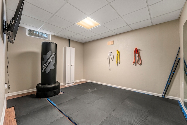 workout area with a paneled ceiling