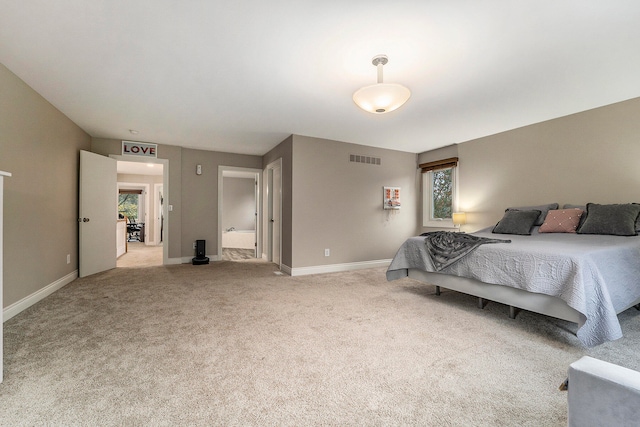 carpeted bedroom with multiple windows