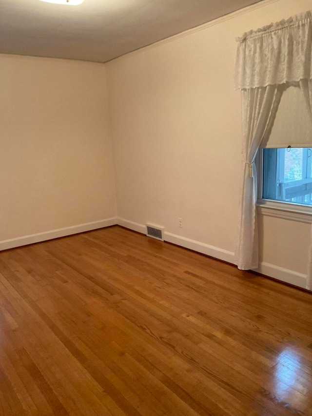 unfurnished room featuring wood-type flooring