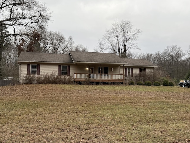 view of front of house featuring a wooden deck and a front yard