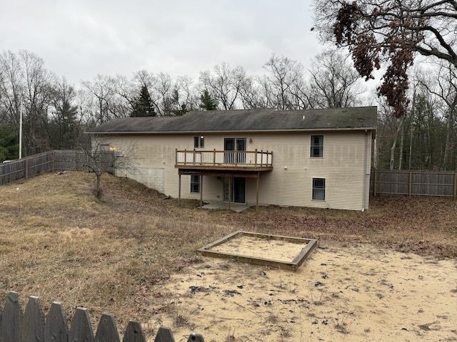 back of property with a deck