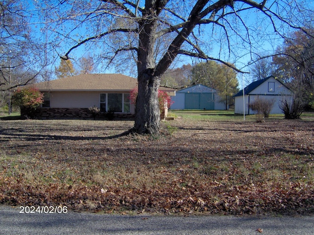 view of home's exterior with an outbuilding